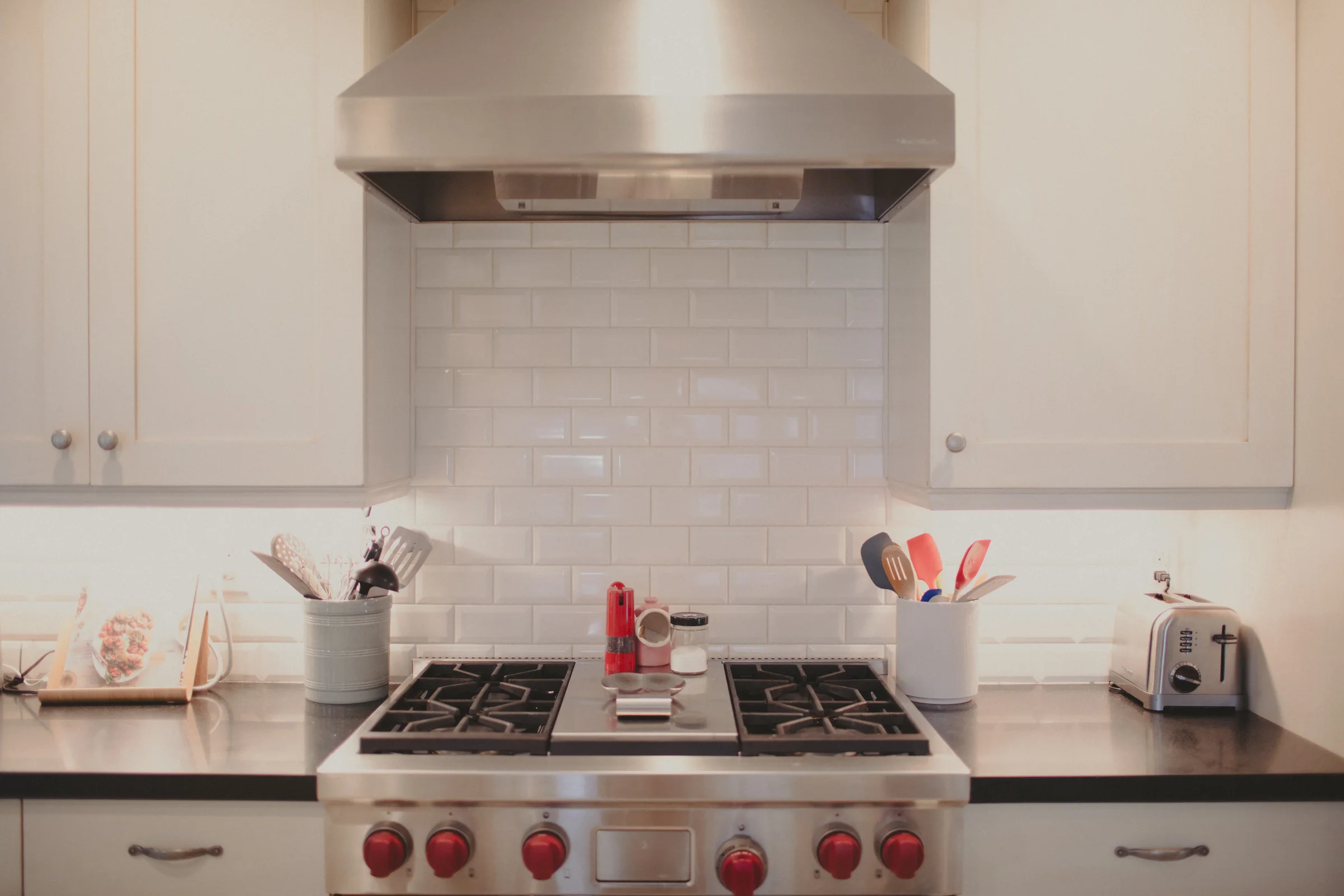 A bright, orderly kitchen with clear counters and everyday tools close at hand